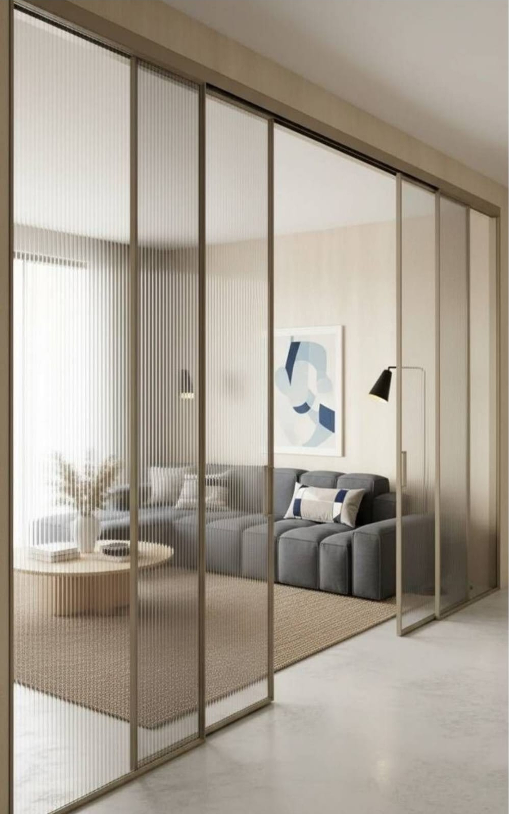 Fluted glass sliding doors in champagne aluminium frames